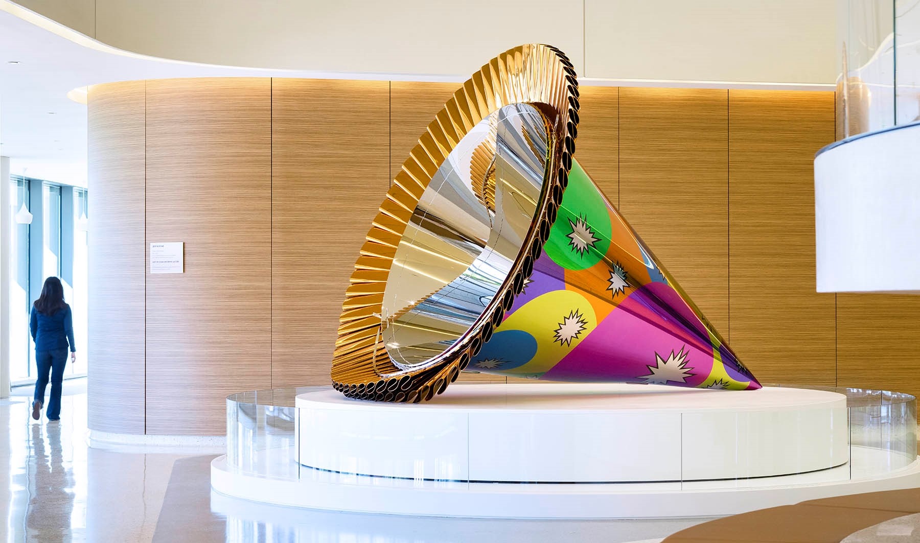 brightly colored metallic party hat on a stand