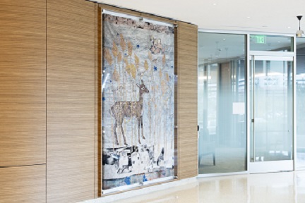 tapestry featuring a deer in a forest, hanging on  wall
